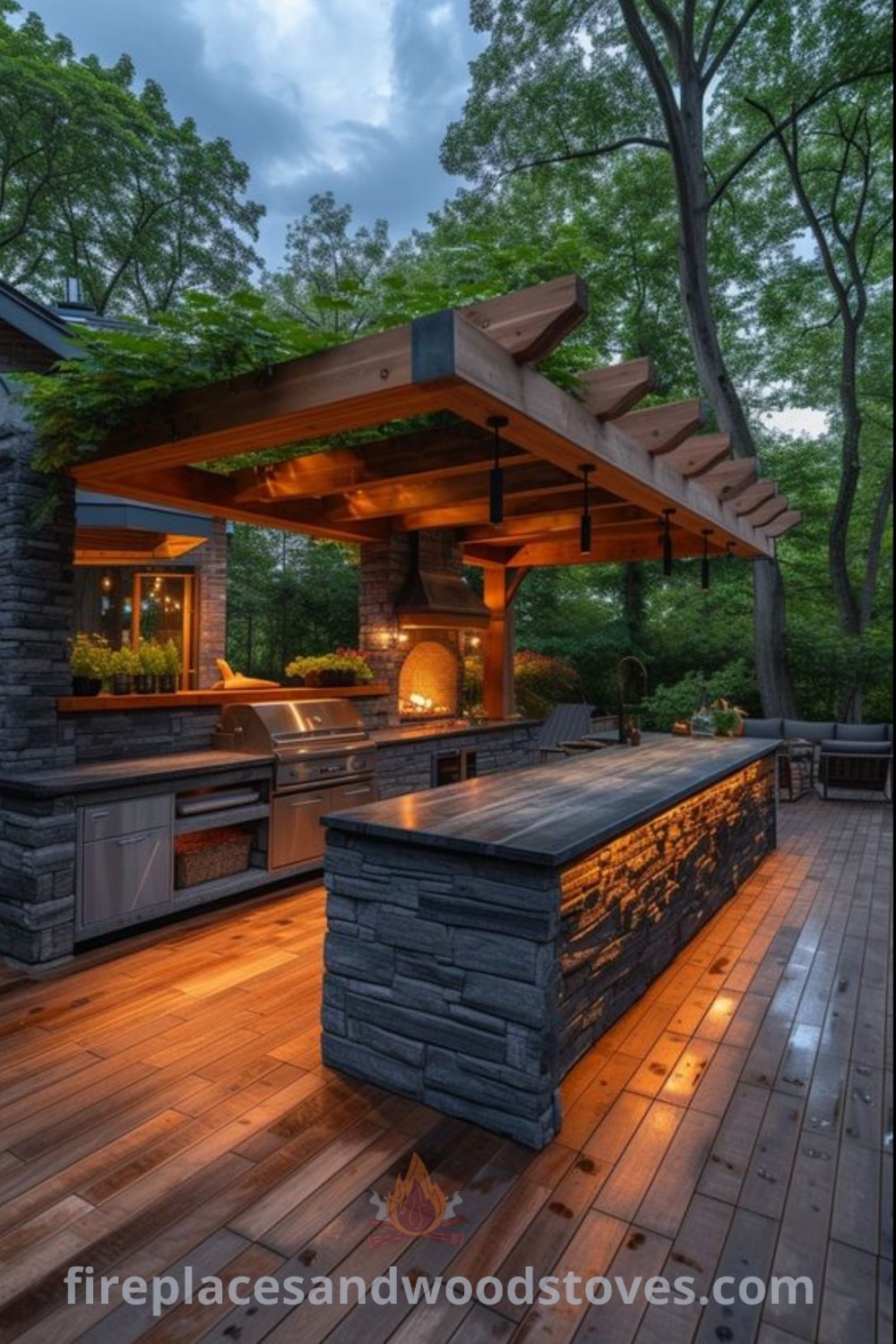 An outdoor kitchen at night showcasing a stylish grilling area, cozy patio bar, and warm lighting on wood flooring, designed for backyard cooking and entertaining. Discover more outdoor kitchen ideas at patioandhomefurniture.com.