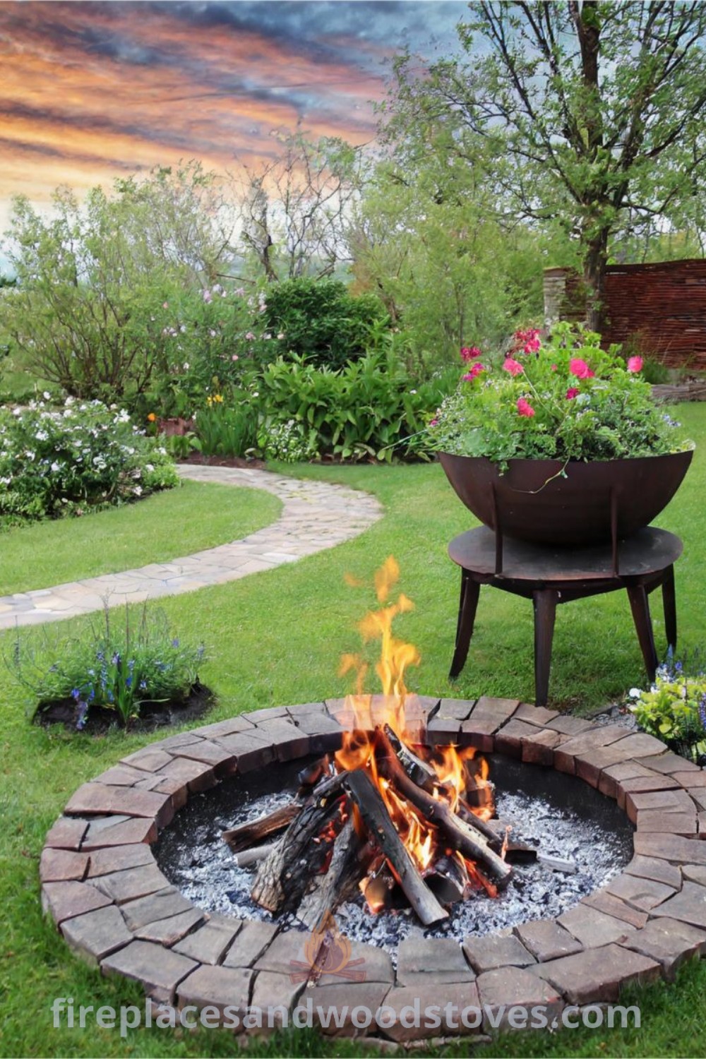 A rustic fire pit in a beautifully landscaped garden, offering cozy outdoor space ideas for gatherings. Discover stylish fire pit designs and landscaping inspiration at patioandhomefurniture.com.