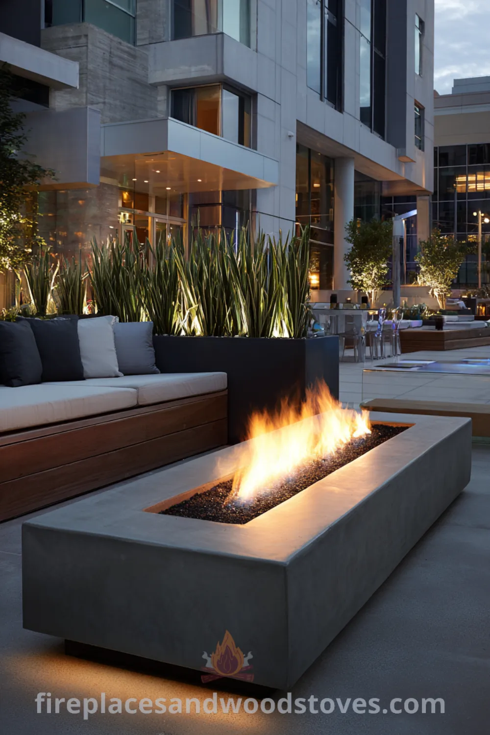 Modern minimalist fire pit with concrete and integrated planters, offering a clean flame and tranquil gathering spot.